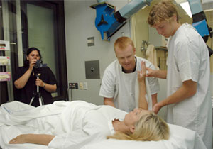 TLDG's Paula Wilson films Beth Sheba getting a plaster cast on her arm by RDH physiotherapist Simon Drew